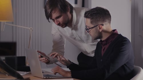 Two Colleagues Working Together in an Office