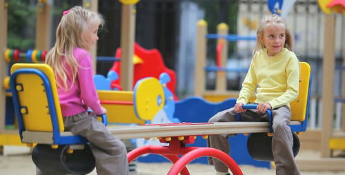 Twins On Swings