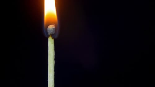 Matchstick Ignition in Macro on Black Background