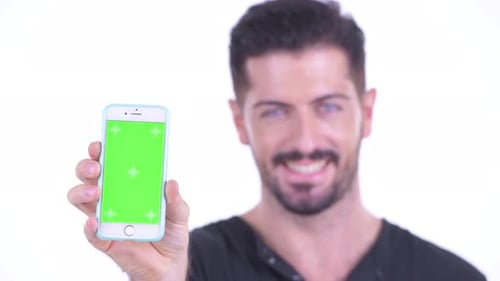 Man Holding Smartphone with Chroma Key Screen