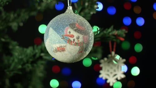 Christmas Tree Ornament with Snowman in Night Scene
