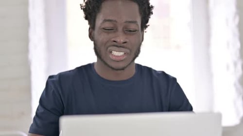 Close Up of African Man Having Headache in Office