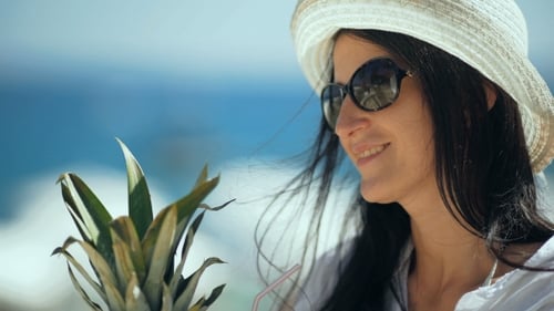 Young Pretty Woman Drinking Tropical Cocktail On The Beach.