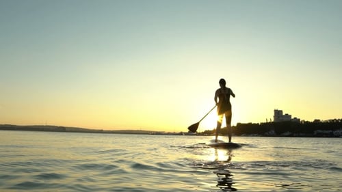 Beautiful Woman On Stand Up Paddle Board