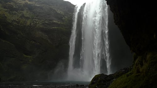 Majestic Waterfall Cascading Through Lush Green Landscape