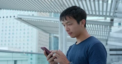 Man Use of Mobile Phone in City