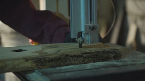 Artisan Using Cutting Machine to Shape Wood