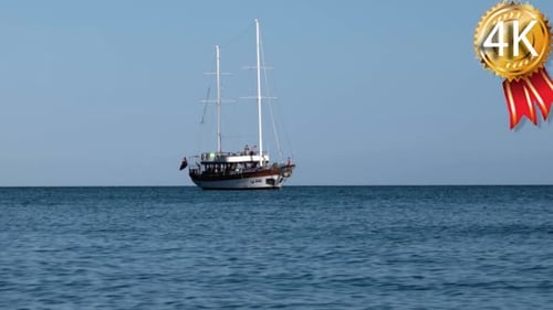 Yacht With Tourists Infront of the Island