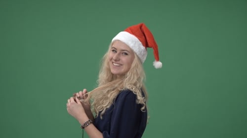 Smiling Woman in Santa Hat on Green Screen