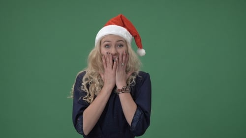 Smiling Young Woman in Santa Hat on Green Screen