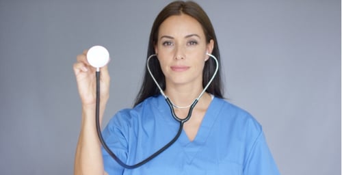 Woman Doctor Holding Up Stethoscope Head