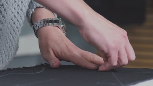 Cutting Fabric. Сut Out Of a Fabric For Clothing In a Design Studio.