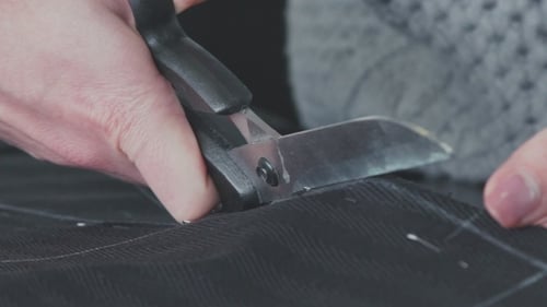 Cutting Fabric. Сut Out Of a Fabric For Clothing In a Design Studio.