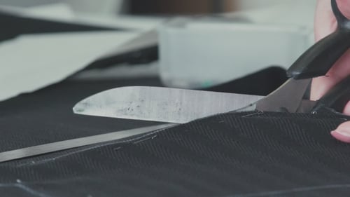 Scissors Cutting Fabric Close Up