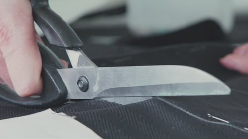 Cutting Fabric. Сut Out Of a Fabric For Clothing In a Design Studio.