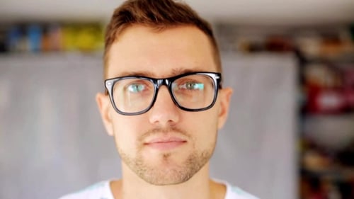 Smiling Young Man in Glasses Close Up Portrait