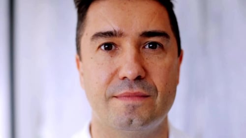 Close Up of Smiling Man Looking at Camera