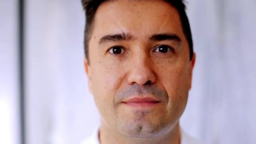 Adult Man Smiles Warmly at the Camera