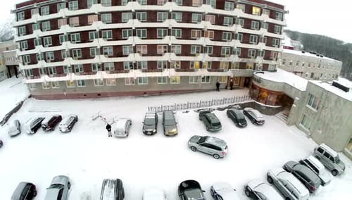 Flying over the car leaving hotel parking