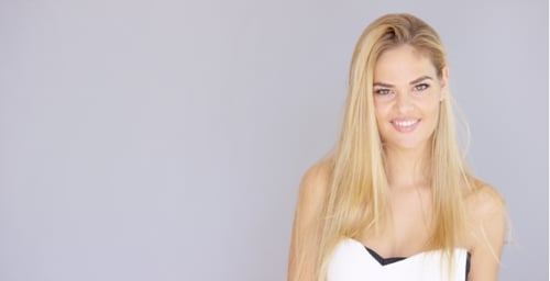 Smiling Woman with Blonde Hair Posing