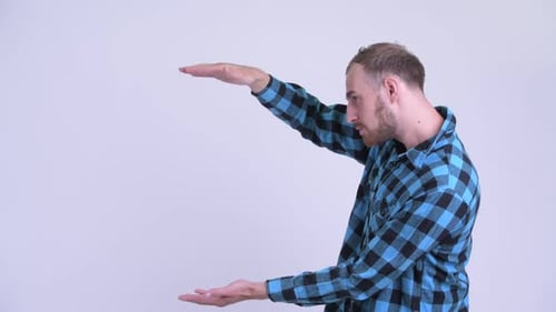 Smiling Man Gesturing and Giving Thumbs Up