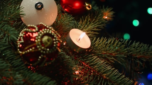 Festive Christmas Tree Decorated with Ornaments and Candle