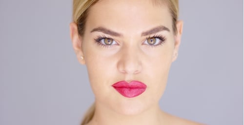 Blonde Woman with Bright Pink Lipstick Posing Close Up