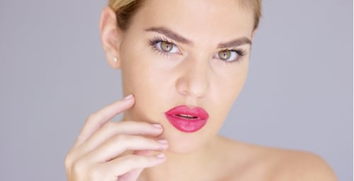 Blond Model with Pink Lipstick Posing
