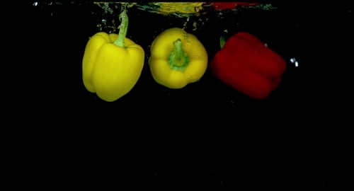 Bell Peppers Dropping Into Water in Slow Motion