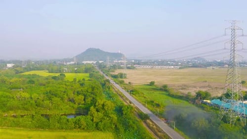 High voltage poles with nature landscape. Power lines on utility tower and cable wires in energy