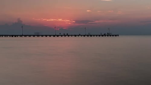 Timelapse of Coming Evening and People on the Pier