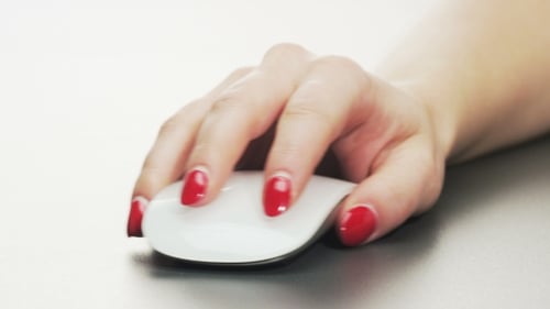 Woman Using Computer Mouse