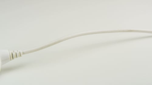 Electrical Plug Being Inserted Into Extension Cord