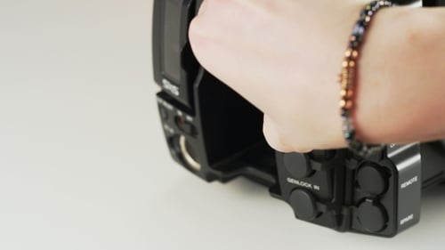 Close Up Attaching Video Cable to Camera