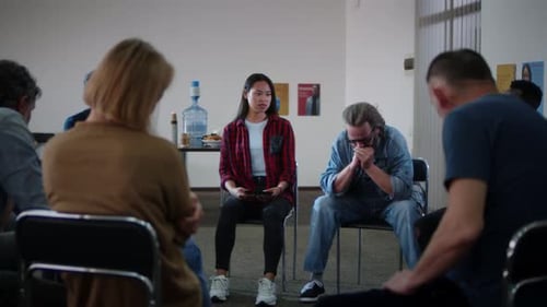 Diverse Adults at Group Therapy Session for Support