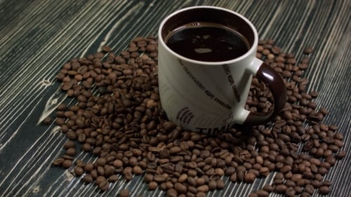 Cup of Coffee and Coffee Beans