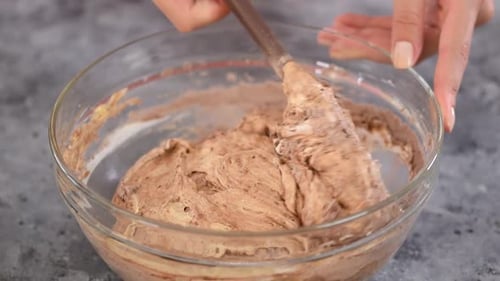 Light Brown Batter Being Stirred in Bowl