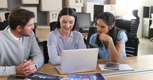 Team Discussing Data in Modern Office