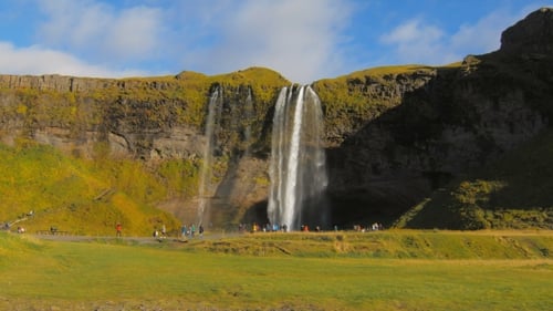 Picturesque Waterfall Flowing in Iceland Landscape