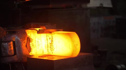 Blacksmith Cutting Hot Metal By Automatical Hammer and Industrial Knife at Plant