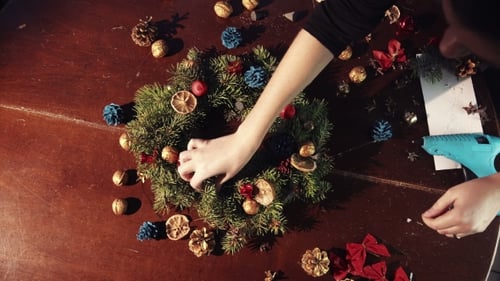 Christmas Wreath Crafting on Wooden Table
