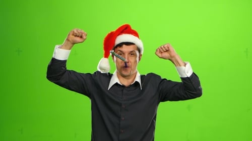 Young Adult Dancing in a Santa Hat on Green Screen