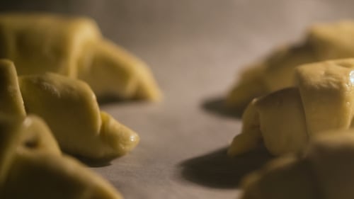 Croissants Baking in Oven turning Golden Brown