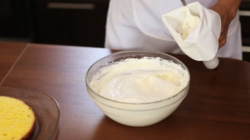 Chef Puts Cream in a Pastry Bag