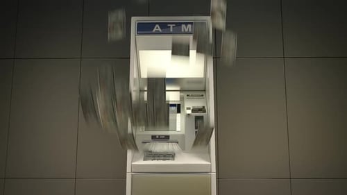 The ATM used to withdraw money. They burst out of the slot and falling down.