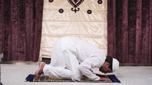 Young Man Kneeling for Prayer