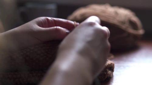 Hands Knitting Cozy Brown Wool Fabric