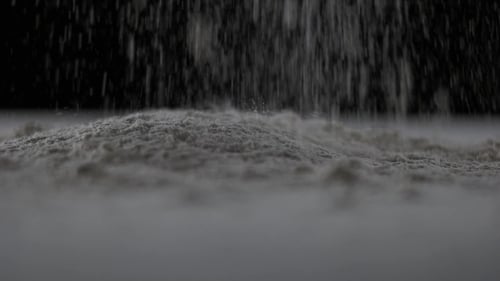 Powder Pouring onto Surface in Studio