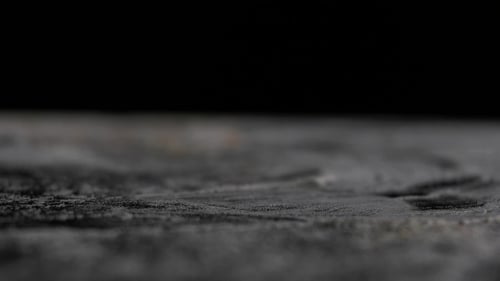 Nuts Fall on the Table Black Background