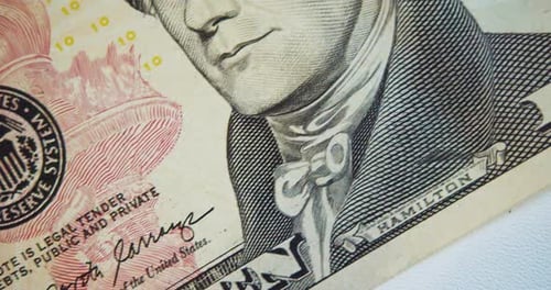 The Camera Moves Along the Ten Dollar Bill
